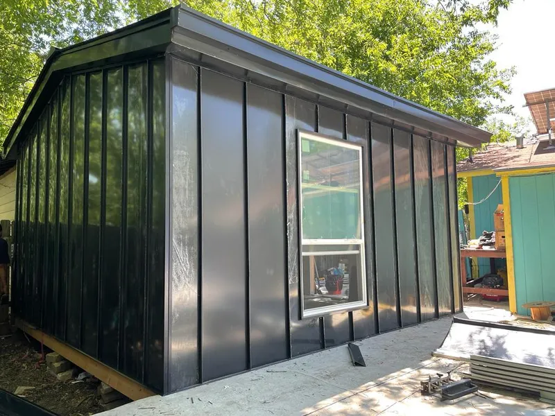 Black standing seam metal wall panels for Metal Roof Installation in Laramie